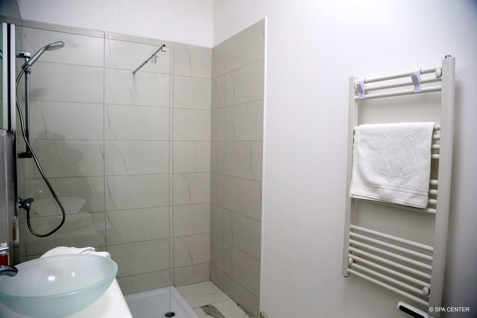 Shower, free toiletries, towels, soap