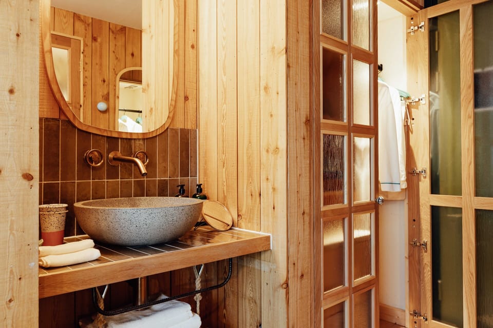 Shower, designer toiletries, hair dryer, towels