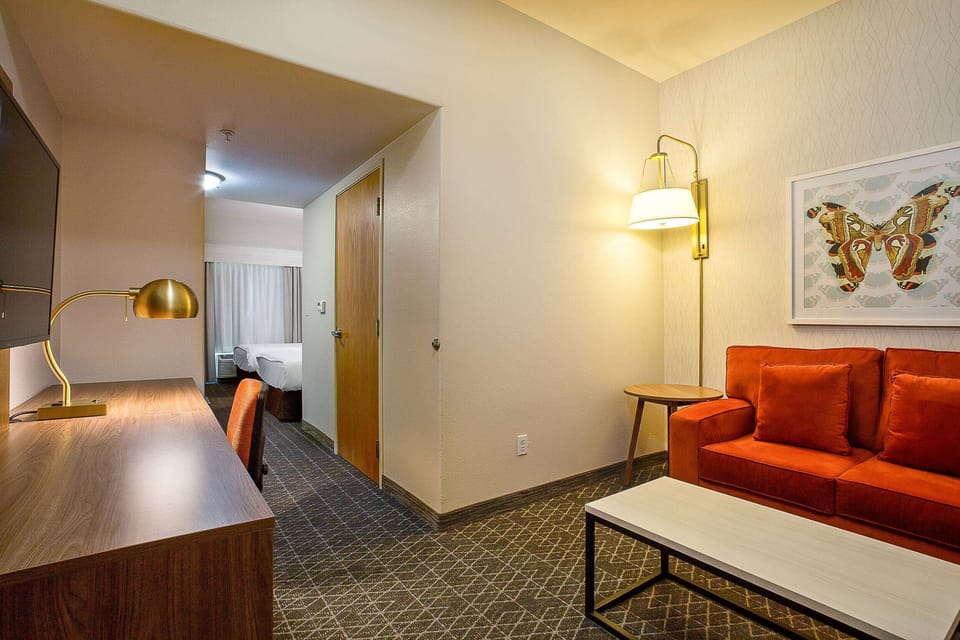 Suite, 2 Queen Beds | Desk, blackout drapes, iron/ironing board, free cribs/infant beds