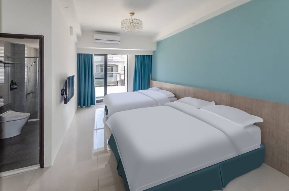 Deluxe Quadruple Room | Premium bedding, down comforters, desk, laptop workspace