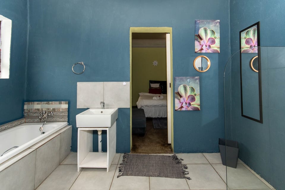 Family Room, 2 Bedrooms, Garden View | Bathroom | Separate tub and shower, rainfall showerhead, hair dryer (on request)