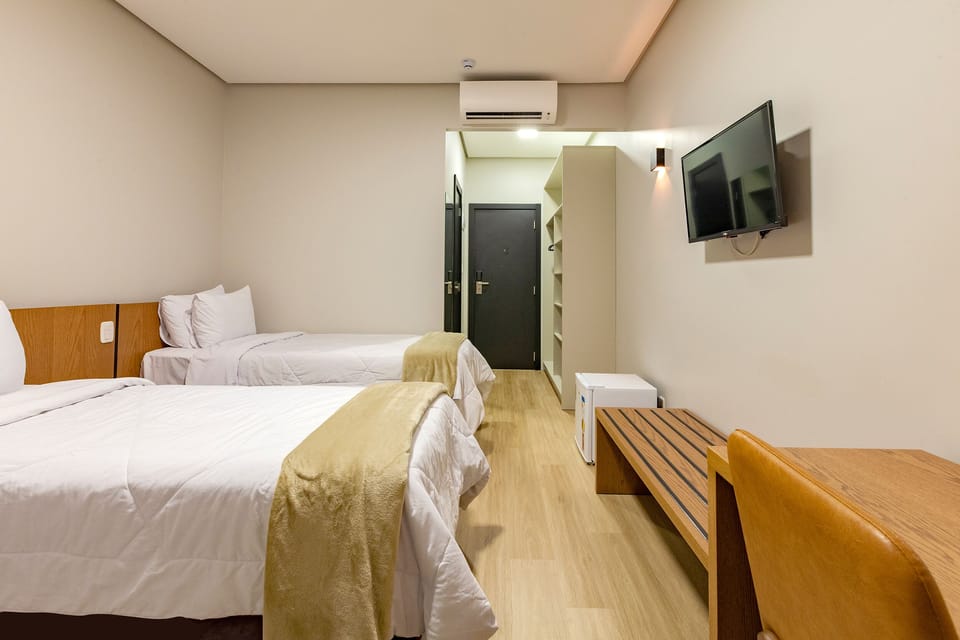 Deluxe Triple Room | Minibar, desk, laptop workspace, free WiFi