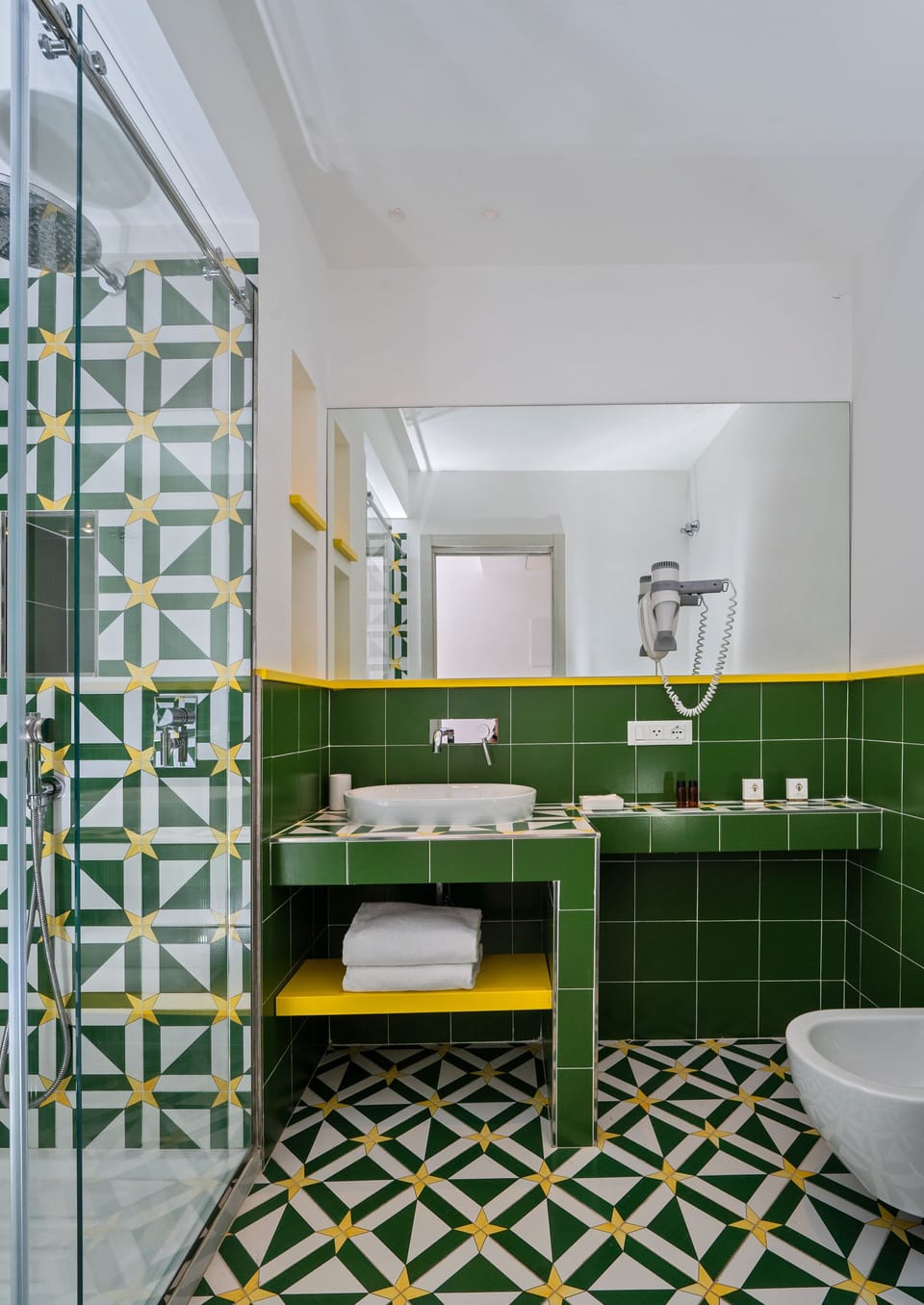 Combined shower/tub, designer toiletries, hair dryer, slippers