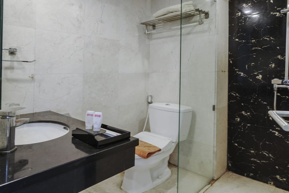 Shower, slippers, towels, shampoo