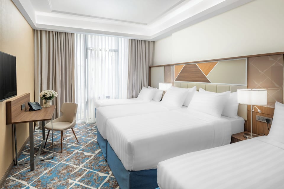 Standard Quadruple Room | In-room safe, desk, soundproofing, iron/ironing board