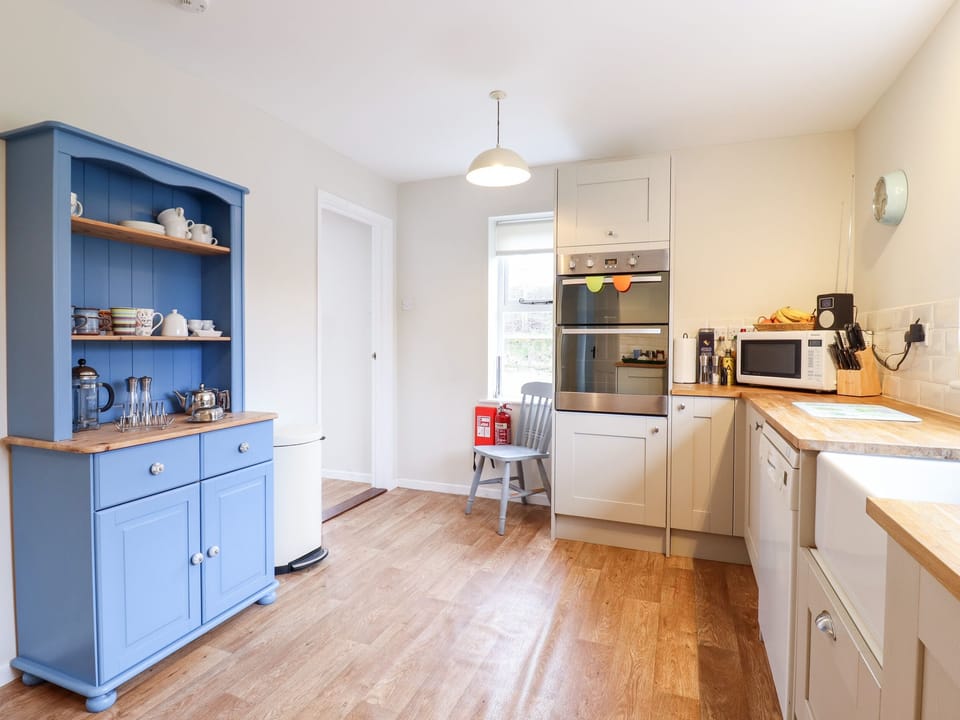 Fridge, electric kettle, toaster, cookware/dishes/utensils