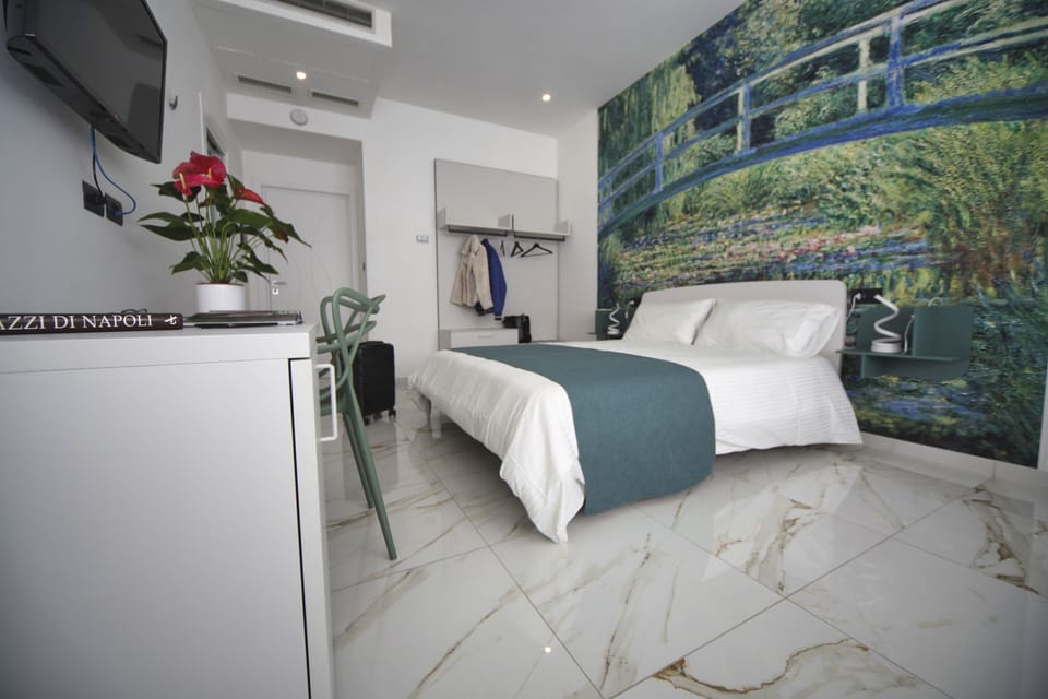 Suite "Ninfea" | Minibar (free items), desk, laptop workspace, blackout drapes