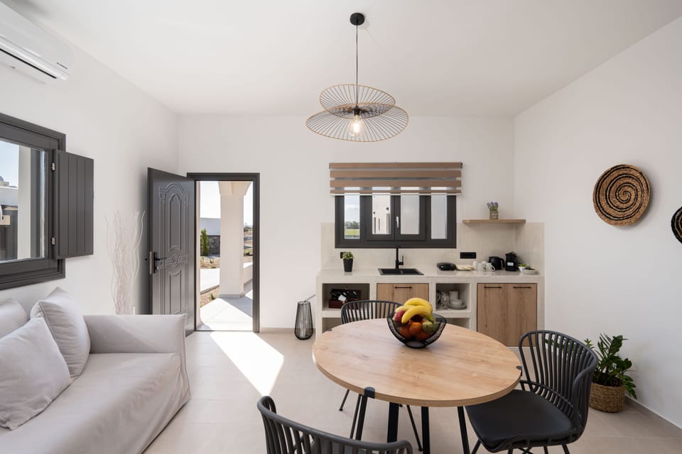 Suite, 1 Bedroom (Avra) | Living area | 42-inch Smart TV with satellite channels, TV, fireplace