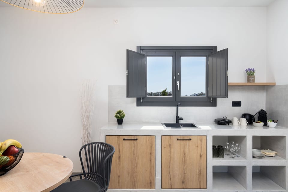Suite, 1 Bedroom (Aithra) | Living area | 42-inch Smart TV with satellite channels, TV, fireplace