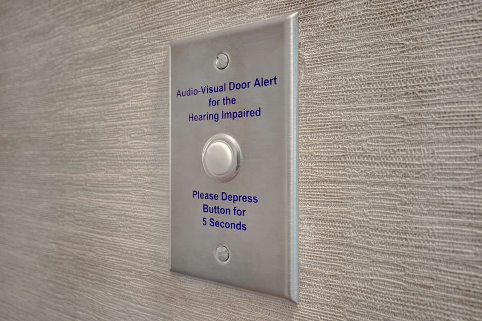 Hypo-allergenic bedding, desk, laptop workspace, blackout drapes