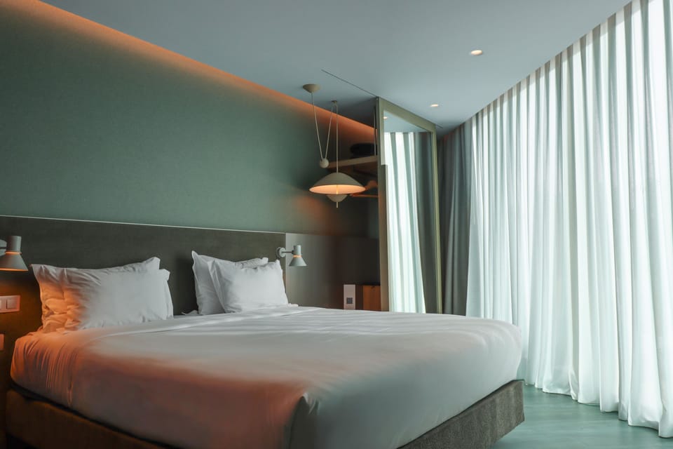 Family Studio Suite | Minibar, desk, laptop workspace, blackout drapes