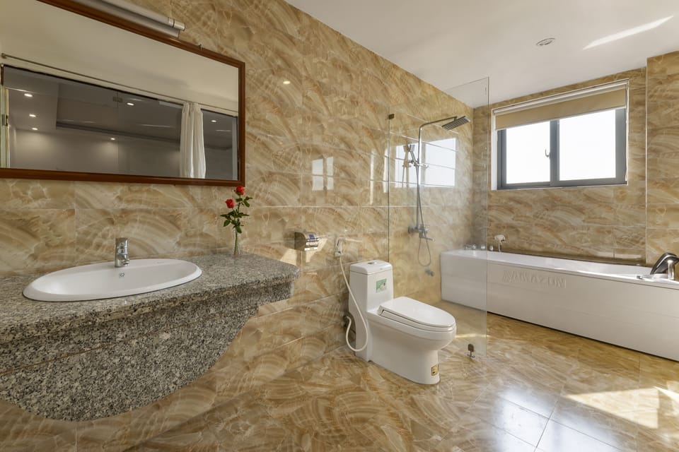 Family Quadruple Room | Bathroom | Rainfall showerhead, hair dryer, slippers, bidet