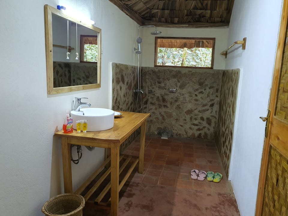 Shower, rainfall showerhead, slippers, towels