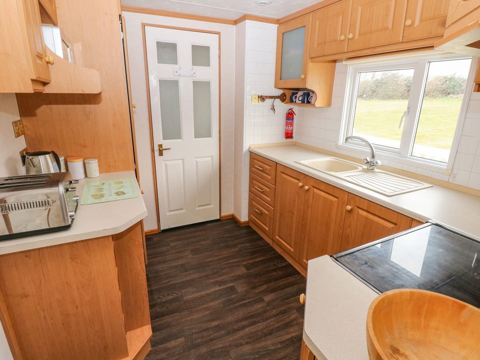 Fridge, electric kettle, toaster, cookware/dishes/utensils