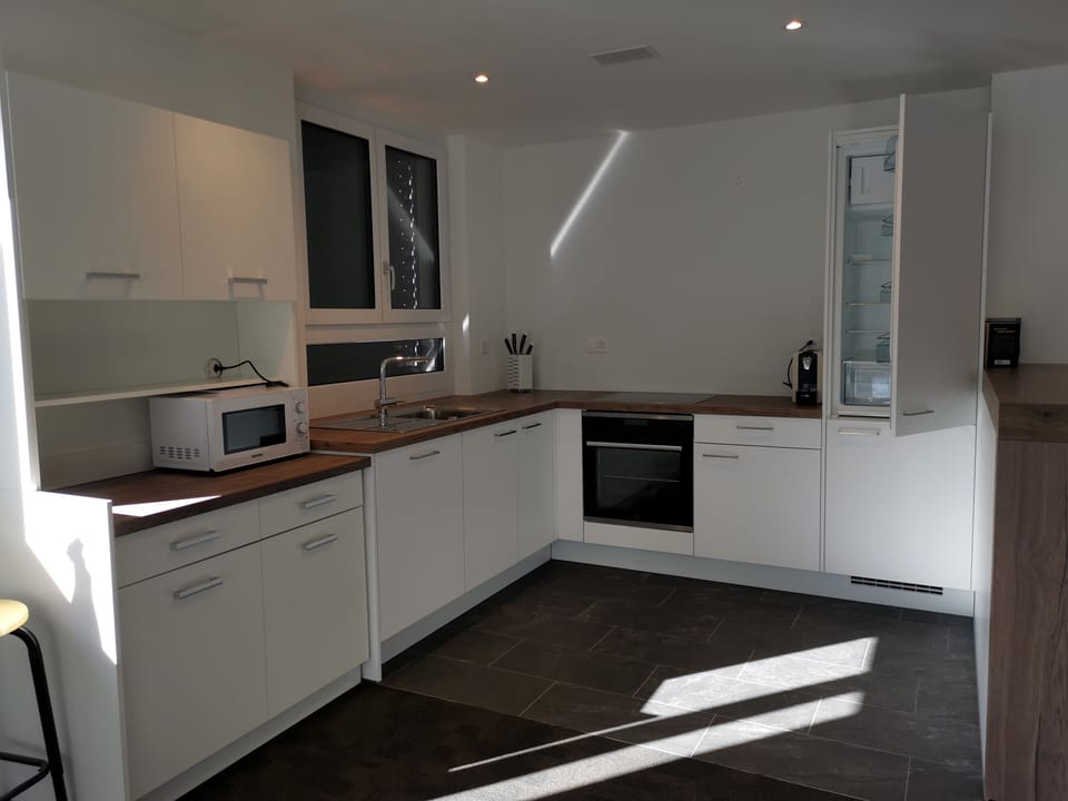Comfort Apartment | Private kitchen | Full-size fridge, microwave, oven, stovetop