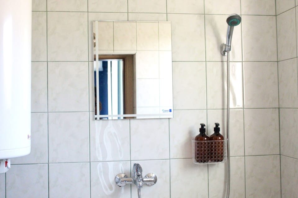Shower, hydromassage showerhead, hair dryer, towels