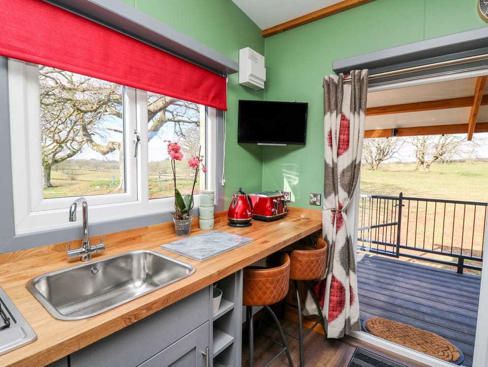 Fridge, electric kettle, cookware/dishes/utensils