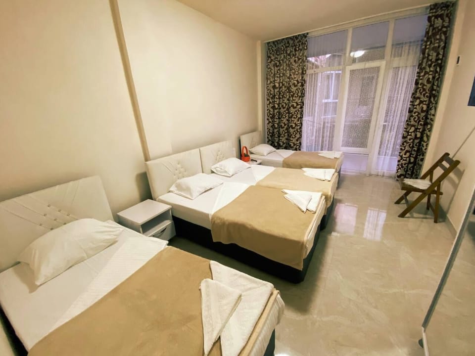 Classic Quadruple Room | Blackout drapes, iron/ironing board, travel crib, free WiFi