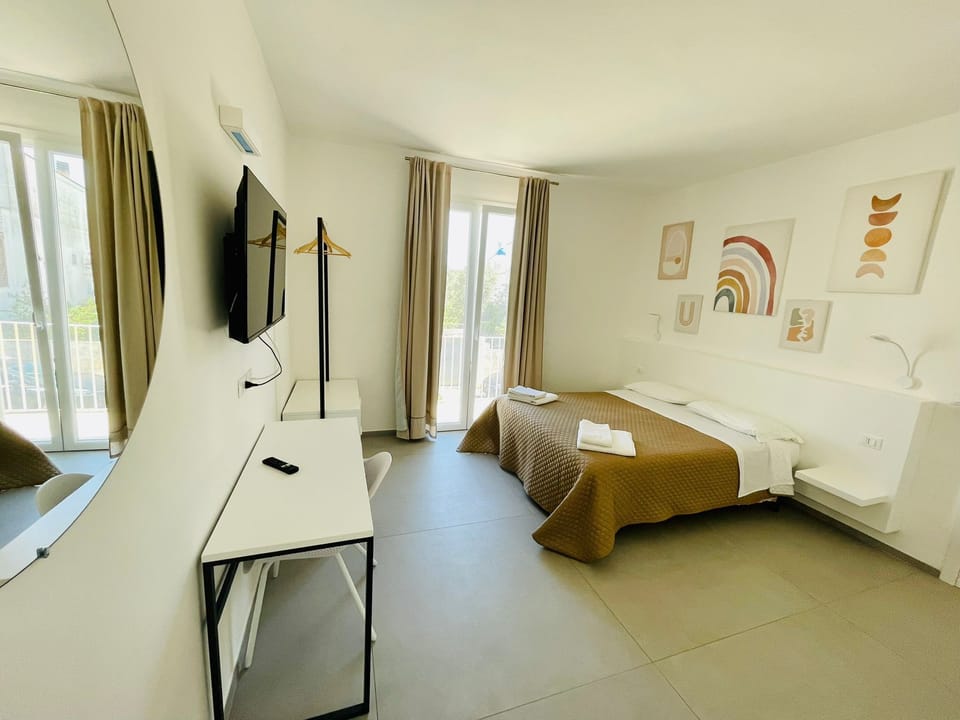 Desk, laptop workspace, free WiFi, bed sheets