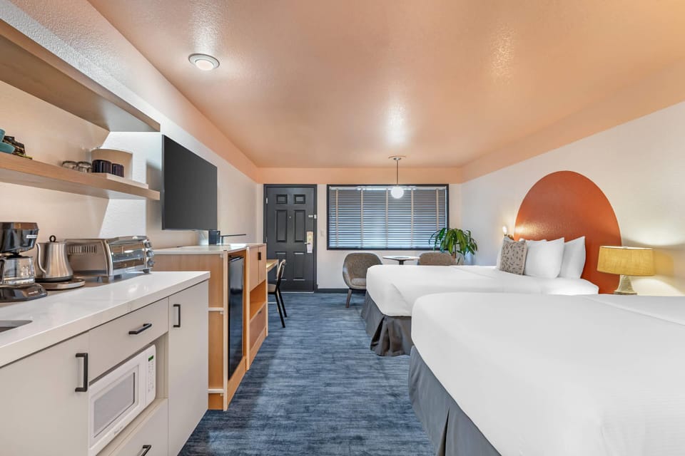 Room, 2 Queen Beds, Non Smoking | In-room safe, desk, laptop workspace, iron/ironing board