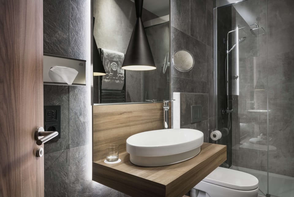 Shower, eco-friendly toiletries, hair dryer, bathrobes