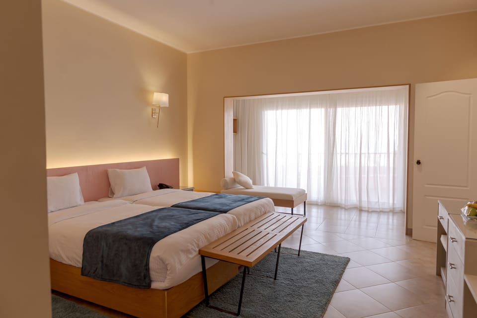 Deluxe Room, 1 Bedroom, Balcony, Sea View | Minibar, in-room safe, blackout drapes, soundproofing