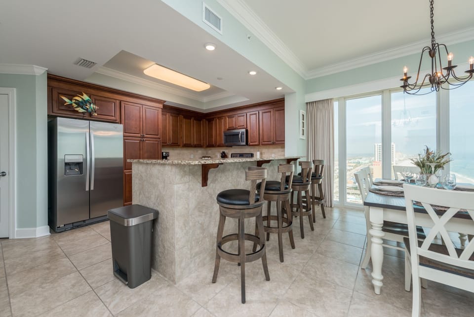 Condo, 4 Bedrooms | Private kitchen | Fridge, oven, coffee/tea maker