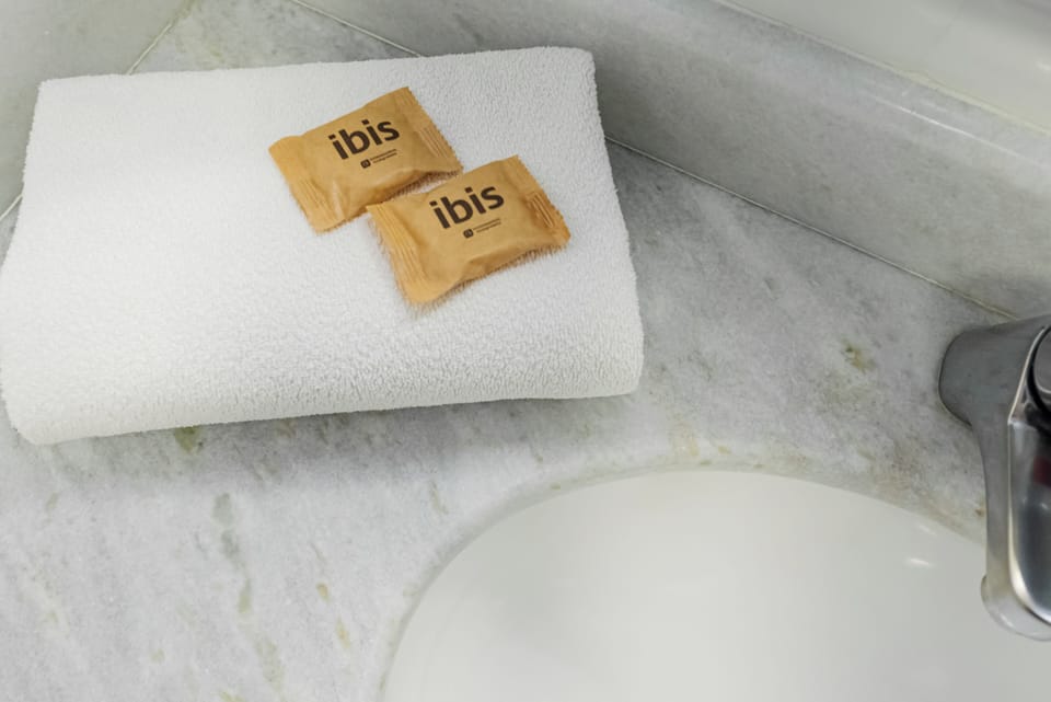 Shower, eco-friendly toiletries, hair dryer, towels