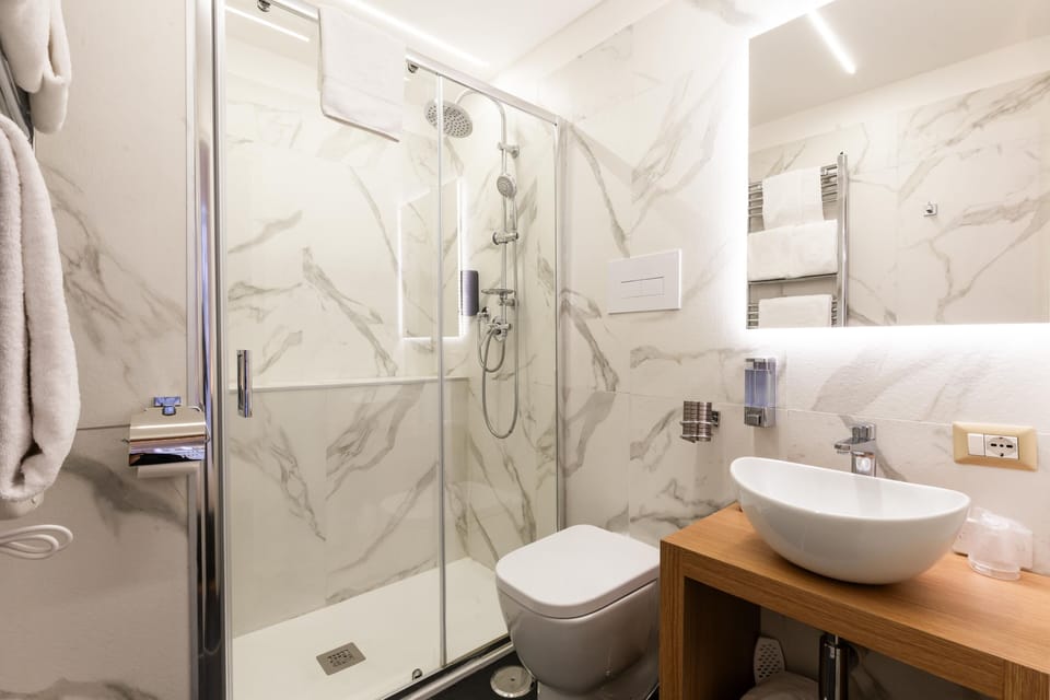 Shower, hair dryer, bathrobes, towels