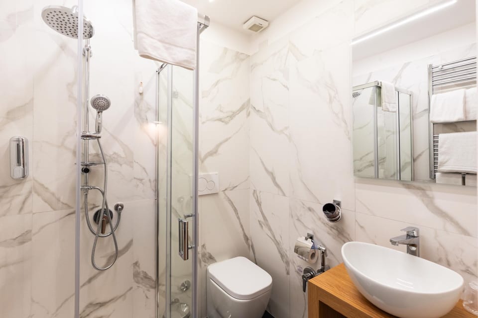 Superior Room, 1 Queen Bed with Sofa bed, Balcony, City View | Bathroom | Shower, hair dryer, bathrobes, towels