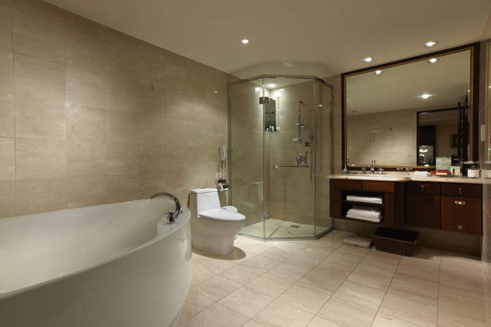 Suite, 1 King Bed (Ambassador) | Bathroom | Separate tub and shower, deep soaking tub, hair dryer, towels