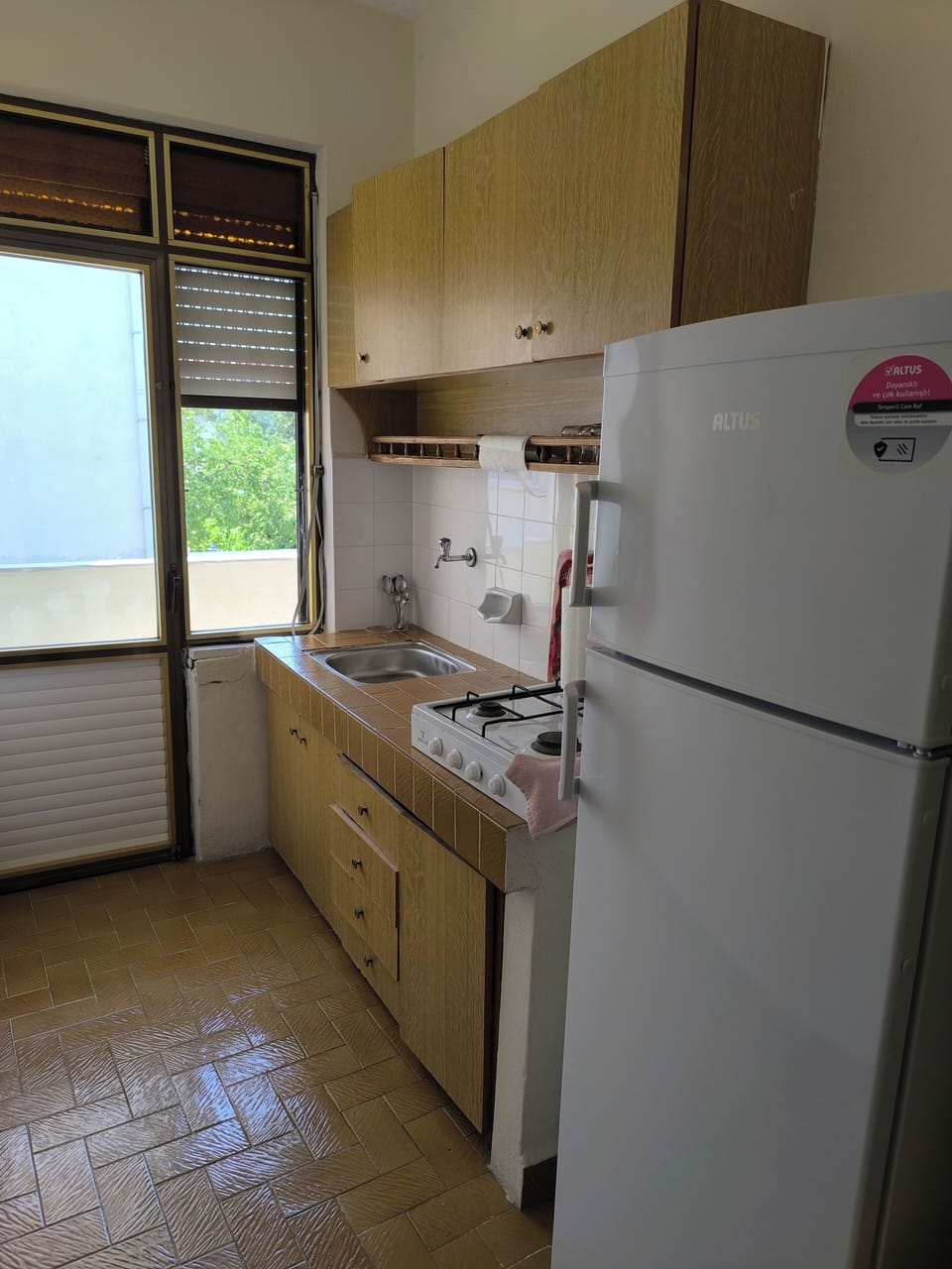Family Apartment | Private kitchen | Mini-fridge, stovetop, cookware/dishes/utensils, paper towels