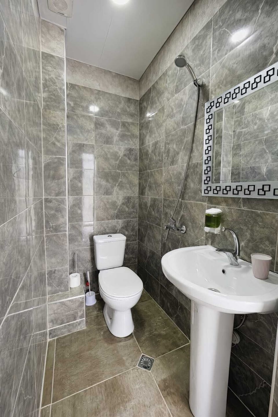 Shower, hair dryer, slippers, towels