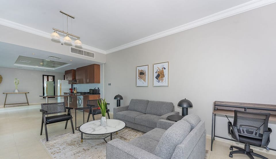 Executive Apartment | Living area | 55-inch Smart TV with cable channels