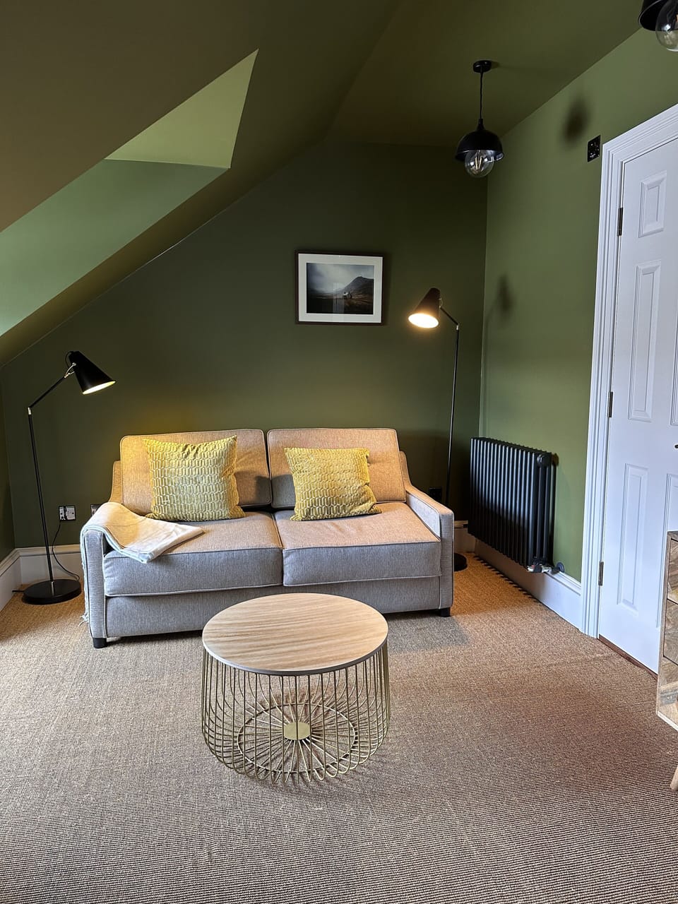 Deluxe Quadruple Room | Living area | Smart speakers