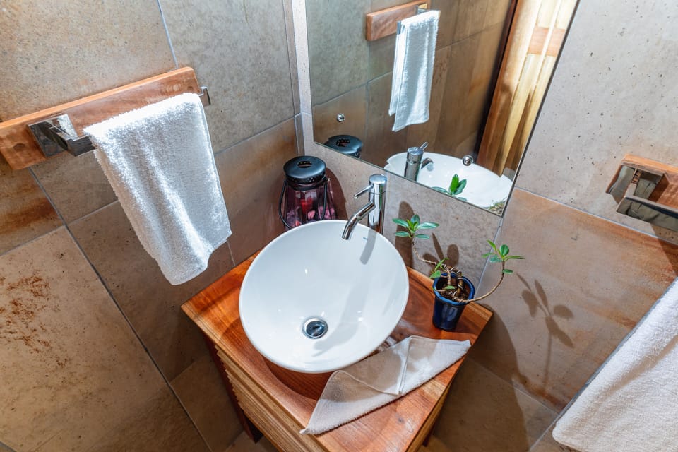 Family Quadruple Room | Bathroom | Shower, rainfall showerhead, towels, soap