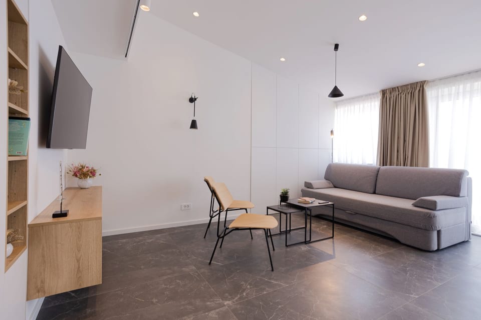 Luxury Apartment | Living area | 55-inch Smart TV with satellite channels, TV, heated floors