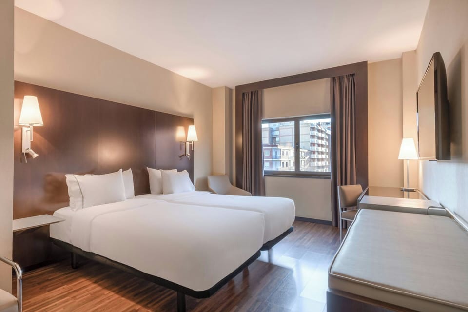 Hypo-allergenic bedding, down comforters, minibar, in-room safe