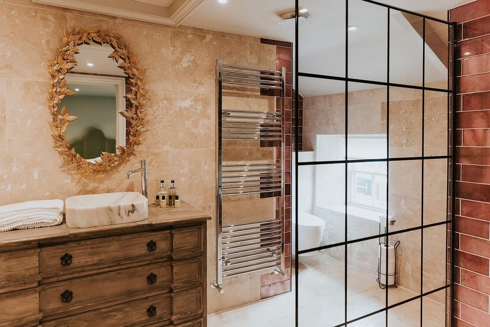 Farm Cottage King Room | Bathroom | Designer toiletries, hair dryer, towels, soap