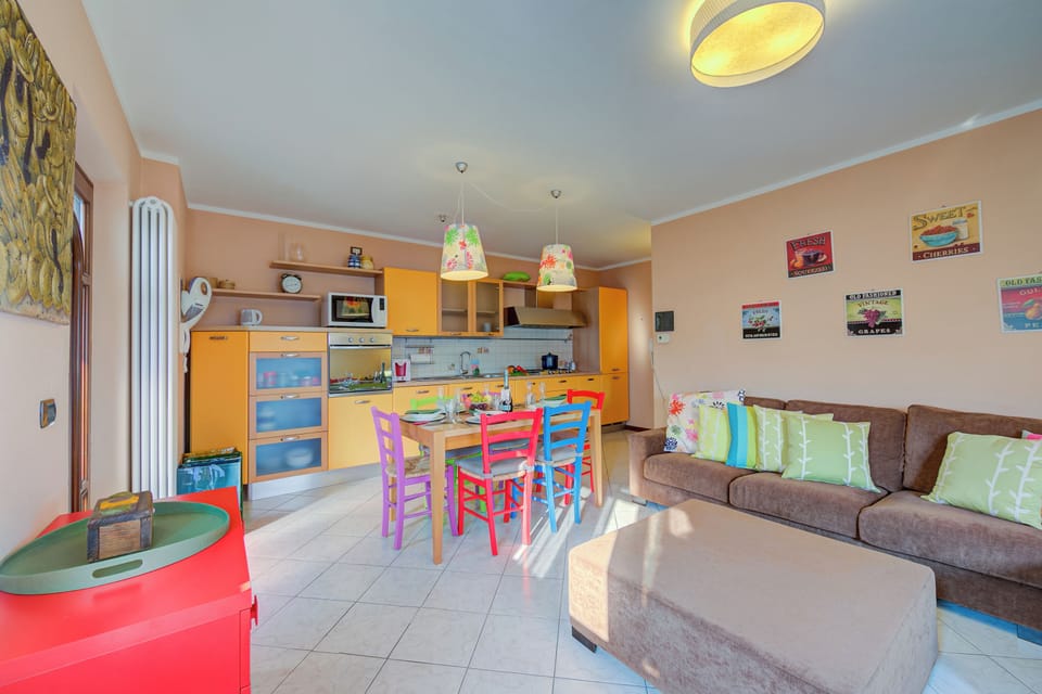 Family Apartment, Multiple Bedrooms (Casa Angiolina Lake & Mountain View) | Living area | 21-inch flat-screen TV with cable channels, TV