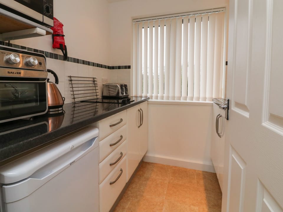 Fridge, electric kettle, toaster, cookware/dishes/utensils