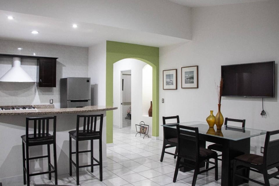 Family Condo | Private kitchen | Cookware/dishes/utensils, dining tables