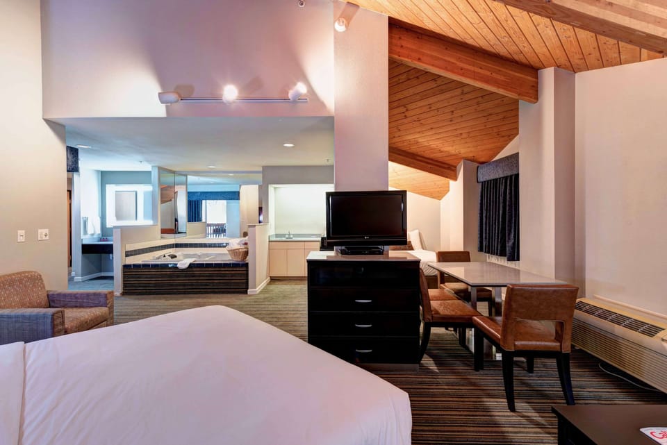 Suite, Multiple Beds, Balcony, Pool View (with Sofabed) | Desk, laptop workspace, iron/ironing board, cribs (free)