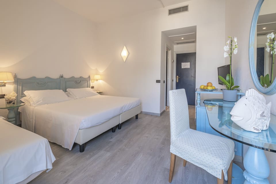Triple Room | Minibar, desk, laptop workspace, bed sheets