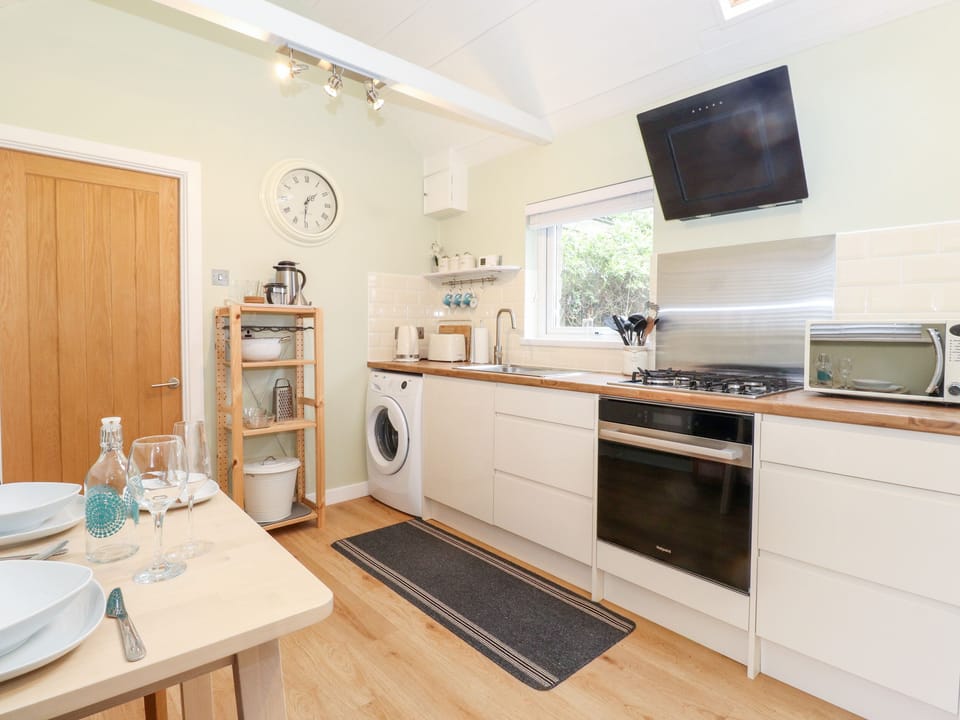 Fridge, electric kettle, toaster, cookware/dishes/utensils