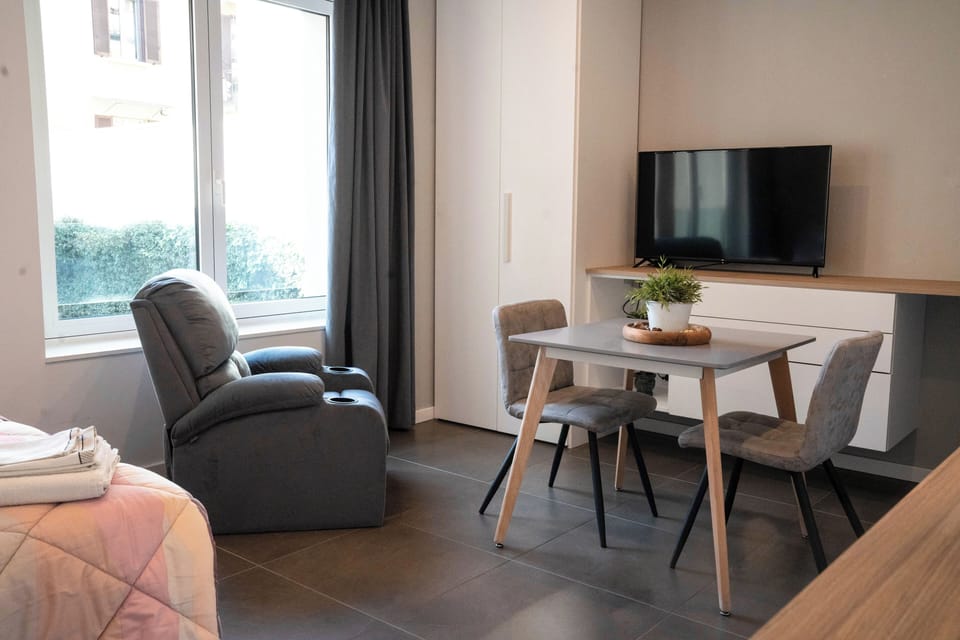 Junior Studio | Living area | 30-inch Smart TV with satellite channels, streaming services