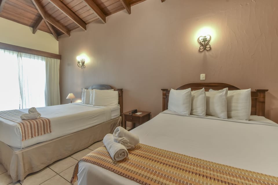 Superior Quadruple Room, 2 Queen Beds | In-room safe, laptop workspace, blackout drapes, iron/ironing board
