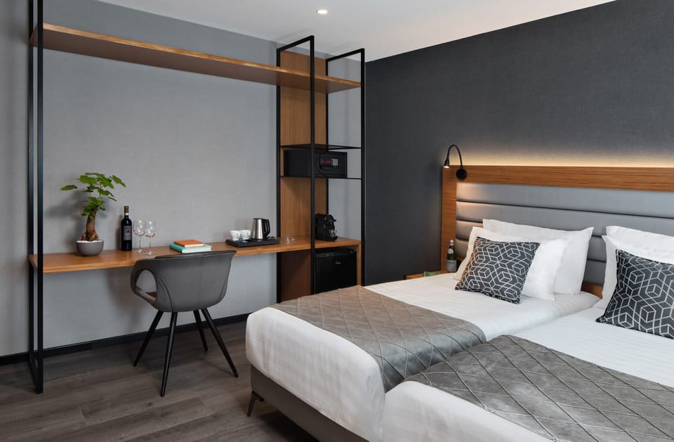 Superior Double or Twin Room | Minibar, in-room safe, desk, laptop workspace