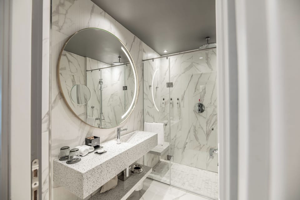 Designer toiletries, hair dryer, bathrobes, slippers
