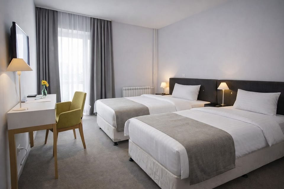 Standard Double or Twin Room | Minibar, in-room safe, desk, laptop workspace